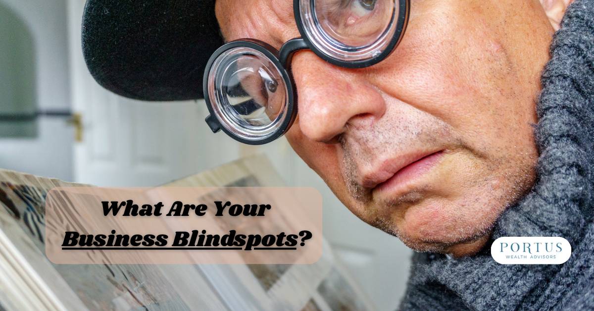 Picture of older man with thick glasses loooking at a book of pictures with the words "What Are Your Business Blindspots?"