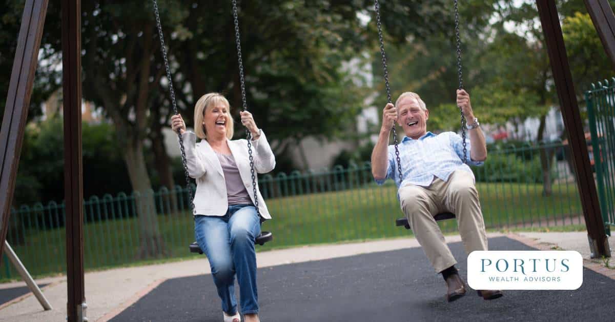 Retired couple on swings enjoying their post-exit pay