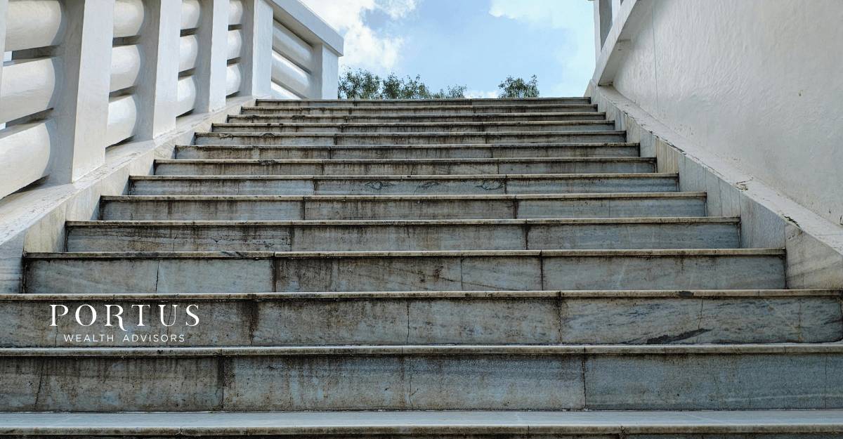 Cement stairs taken from the bottom of the staircase, repseneting the steps needed to take when you want to grow business value before selling. Portus Wealth Advisors logo in the bottom left corner.