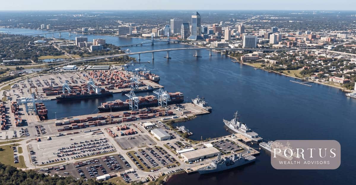 An aerial of JAXPORT with the St. Johns River and the Jacksonville skyline visible in the same frame for the "Selling My Jacksonville FL Trades Business Exit Guide" blog post by Portus Wealth Advisors.